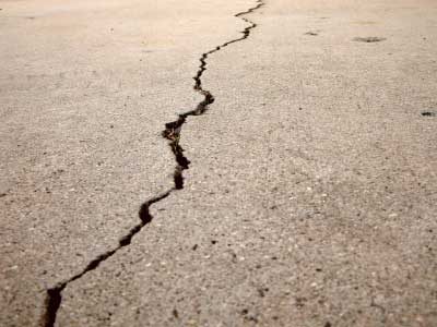 Cracked concrete. We offer concrete repair and maintenance for your commercial properties.