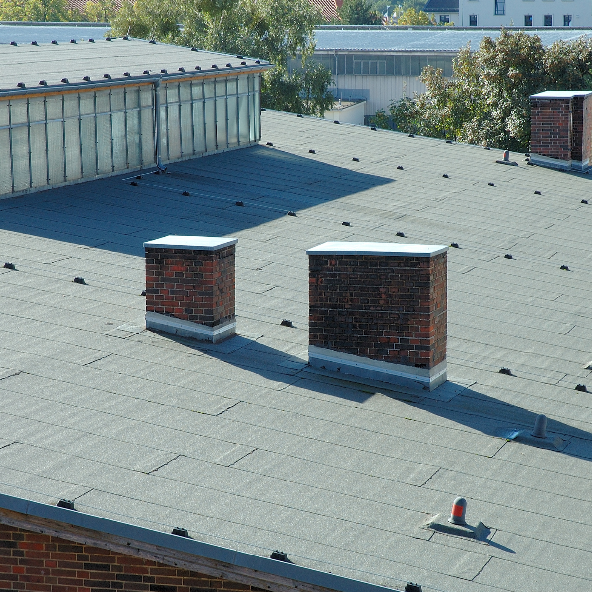Learn more about proactive Houston building maintenance for flat roofs.
